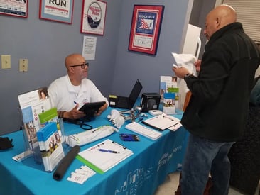 man showing products to customer